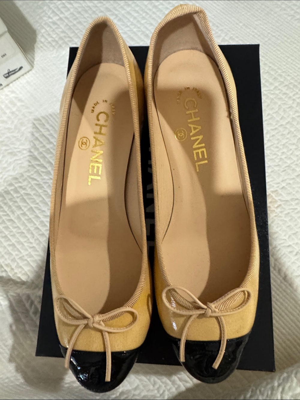 CHANEL Beige and Black Cap-Toe Ballet kitty heel